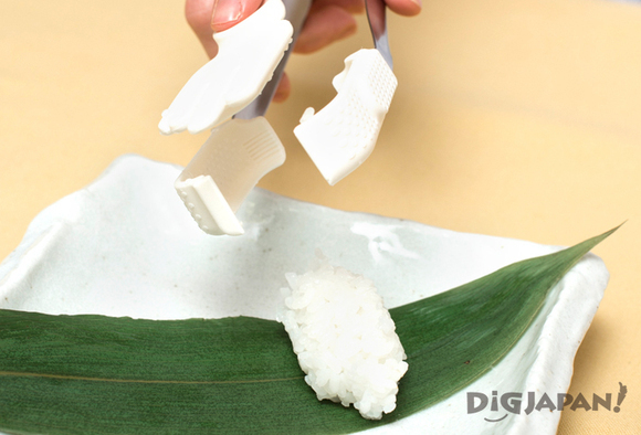 Putting the sushi rice on a plate
